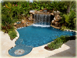 large swimming pool with rock waterfall
